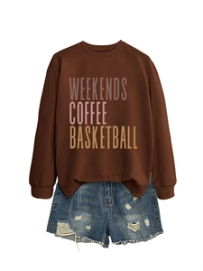 Detail of crewneck sweatshirt showing Weekends Coffee gradient print and ribbed cuffs