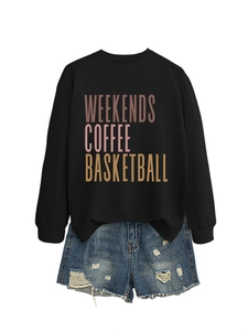 Detail of black sweatshirt with Weekends Coffee print and ripped denim shorts outfit