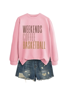 Flat lay of pink sweatshirt with WEEKENDS COFFEE text and distressed denim shorts
