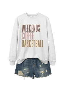 Detail of grey sweatshirt with Weekends Coffee Basketball print and denim shorts