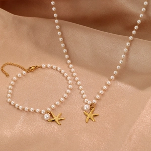 Exquisite 18K gold plated pearl necklace and bracelet set with starfish charm on silk
