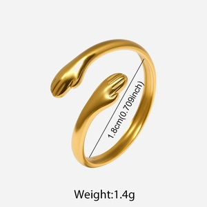 Adjustable gold hug ring in stainless steel with detailed palm design on the open ends