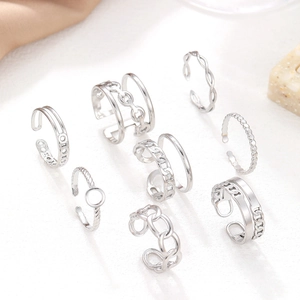8-piece set of silver adjustable rings featuring chain, twist, and wave geometric designs