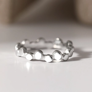 Polished stainless steel ring with creative dotted wave design and silver finish
