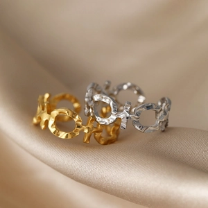 Textured stainless steel open rings in gold and silver with hammer-patterned finish