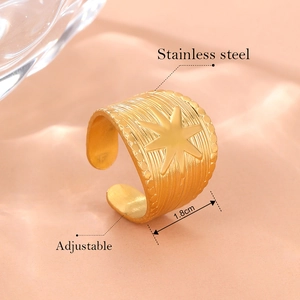 Adjustable 18K gold plated stainless steel wide ring with a star motif and ribbed texture