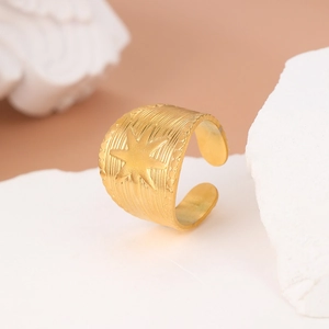 Classic 18K gold plated starburst stainless steel wide open ring on stone pedestal