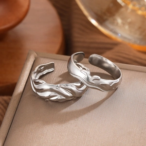 Minimalist silver wavy textured titanium steel open rings set on a premium jewelry box