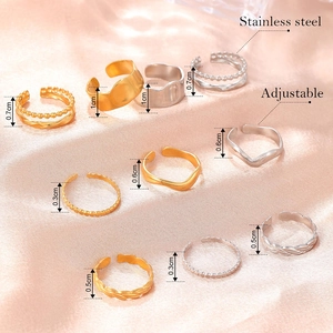 Adjustable stainless steel wave ring set in gold and silver finishes for women