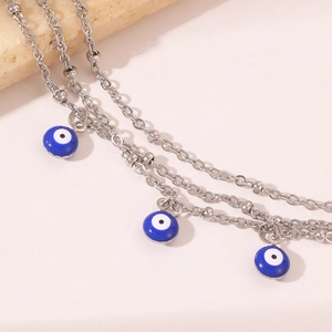 Bohemian multi-layer evil eye anklet with silver beads and blue enamel charms