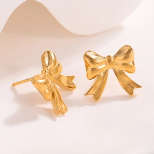 Elegant gold bow-shaped stainless steel stud earrings with a matte brushed finish