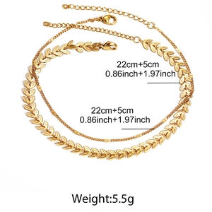 Double-layered gold anklet set featuring wheat leaf and circle chain with lobster clasp