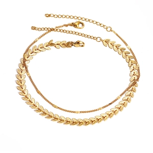 Elegant gold double layer anklet featuring leaf texture design and minimalist chain