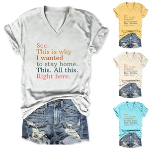 Detail of V-neck T-shirt with graphic print and rolled sleeves with denim shorts