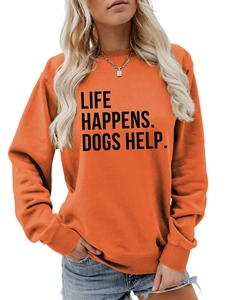 Detail of ribbed cuffs and slogan print on orange long sleeve cotton crewneck sweatshirt