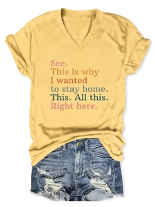 Detailed flat lay of a yellow V-neck T-shirt with text paired with frayed denim shorts