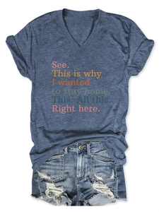 Flat lay of women's V-neck T-shirt with Stay Home print and distressed denim shorts