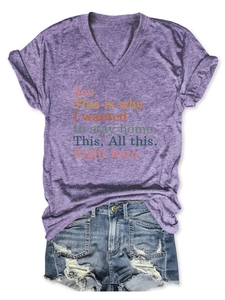 Flat lay of purple V-neck T-shirt with colorful text paired with distressed denim shorts
