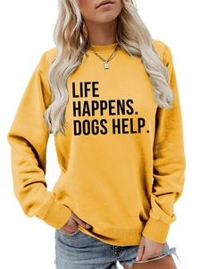 Detail of the Life Happens Dogs Help slogan printed on a ginger yellow cotton sweatshirt