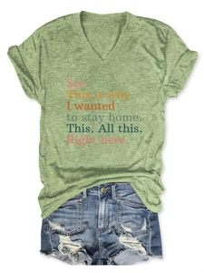 Detail of V-neck green heather T-shirt with quote print and frayed denim shorts
