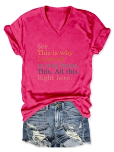 Detail of rose red V-neck T-shirt with text print and distressed denim shorts
