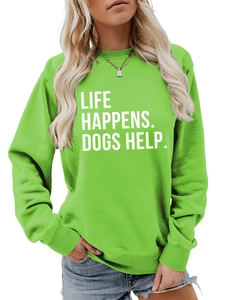 Close-up of Life Happens Dogs Help white slogan print on green sweatshirt fabric