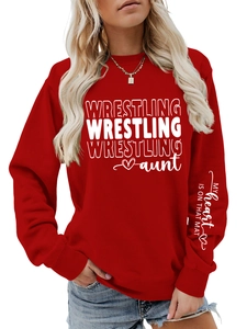 Close-up of WRESTLING aunt logo and printed text on red casual crewneck sweatshirt