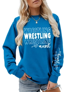 Detail of blue crewneck sweatshirt with 'MY heart IS ON THAT MAT' slogan on sleeve