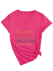 Detail view of pink V-neck t-shirt with text slogan and stylish front knot at the hem