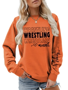 Detail view of the orange sweatshirt with 'My heart is on that mat' print on the sleeve