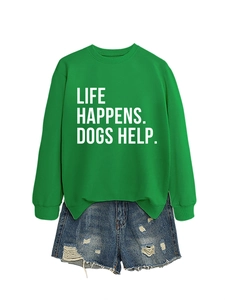 Detail of the Life Happens Dogs Help slogan printed on a green long sleeve sweatshirt
