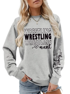 Detail of grey sweatshirt with wrestling aunt print and text on the sleeve cuff