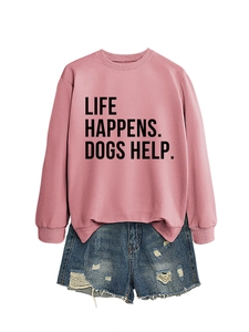 Detail of pink crewneck sweatshirt with slogan print and distressed denim shorts