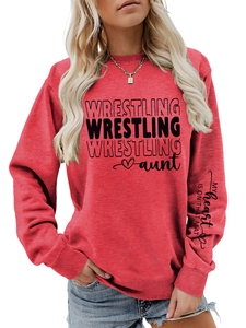Detail of red crewneck sweatshirt featuring unique sleeve text and wrestling aunt print
