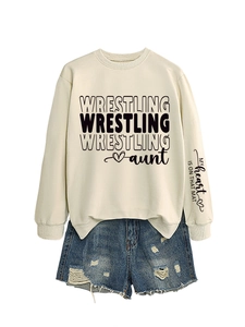 Detail of sleeve print MY heart IS ON THAT MAT on beige wrestling aunt sweatshirt