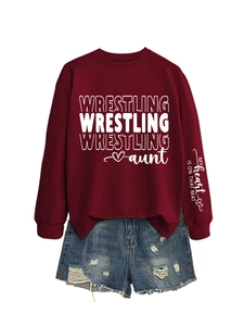 Close-up of sleeve print with slogan and burgundy wrestling aunt sweatshirt fabric detail