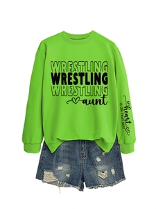 Detail of neon green sweatshirt sleeve featuring My Heart Is On That Mat printed text