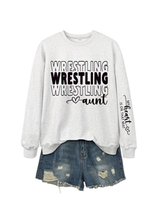 Close-up of sleeve print detail MY heart IS ON THAT MAT on gray sweatshirt and denim shorts