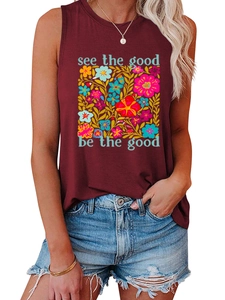 Detail eines weinroten Tanktops mit buntem Blumendruck und See the good be the good Spruch