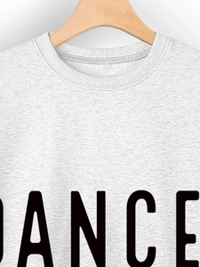 Close-up of Dance Mama grey sweatshirt neckline with black letter print and ribbed collar