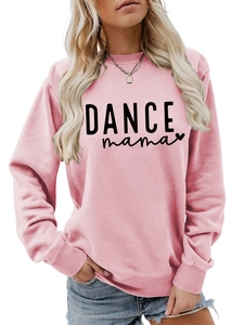 Close-up of pink crewneck sweatshirt featuring black DANCE mama text and heart print