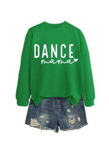 Detail view of a bright green DANCE mama sweatshirt with blue distressed denim shorts