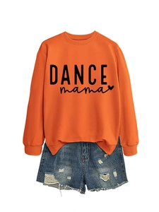 Detail of orange crewneck sweatshirt with Dance Mama print and distressed denim shorts