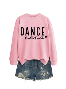 Close-up of pink crewneck sweatshirt with DANCE mama print and distressed denim shorts