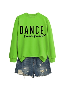 Detail of a bright green long sleeve sweatshirt with DANCE mama print and denim shorts