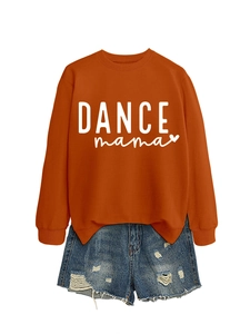 Flat lay of caramel 'DANCE mama' sweatshirt paired with distressed denim shorts