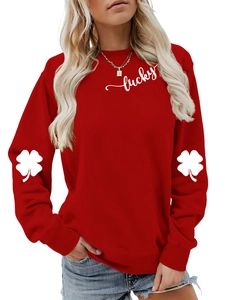 Close-up of red crewneck sweatshirt with lucky lettering and clover sleeve prints