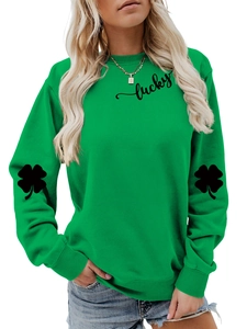 Detail of green crewneck sweatshirt featuring lucky text and clover arm prints