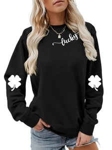 Detail of clover print on sleeves and lucky text on black long sleeve sweatshirt