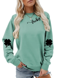 Detail of clover print on mint green sweatshirt sleeve with lucky letter graphic